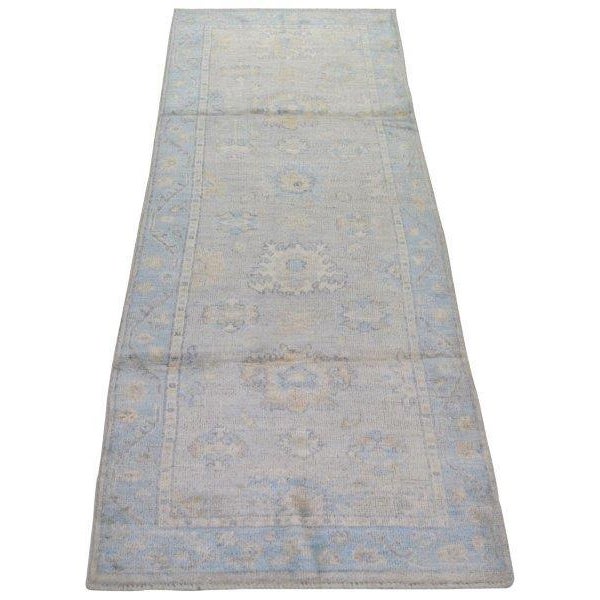 Hand-knotted with care using traditional rug-making techniques, this wool rug blends timeless craftsmanship with a modern...