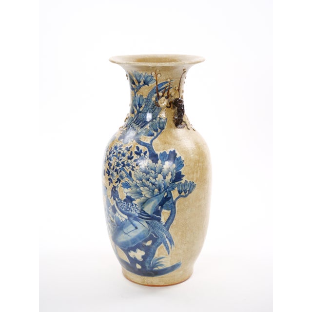 A beautifully crafted mid-20th-century Chinese porcelain vase, finely decorated in underglaze cobalt blue with elegant...
