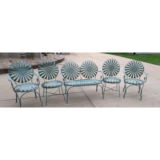1930 Francois Carre Sunburst Set of 5. 2 Chairs with armrest and two without. Also included is a beautiful two seater...