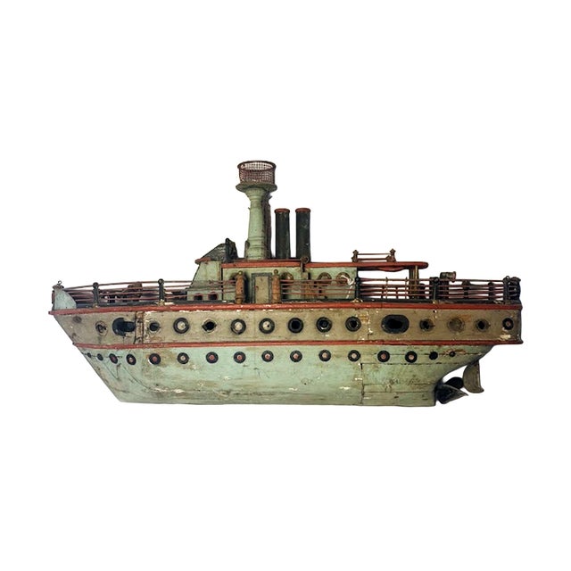 Handmade American folk art naval model of an armed boat, likely dating from the early to mid-20th century. It has a heavy...