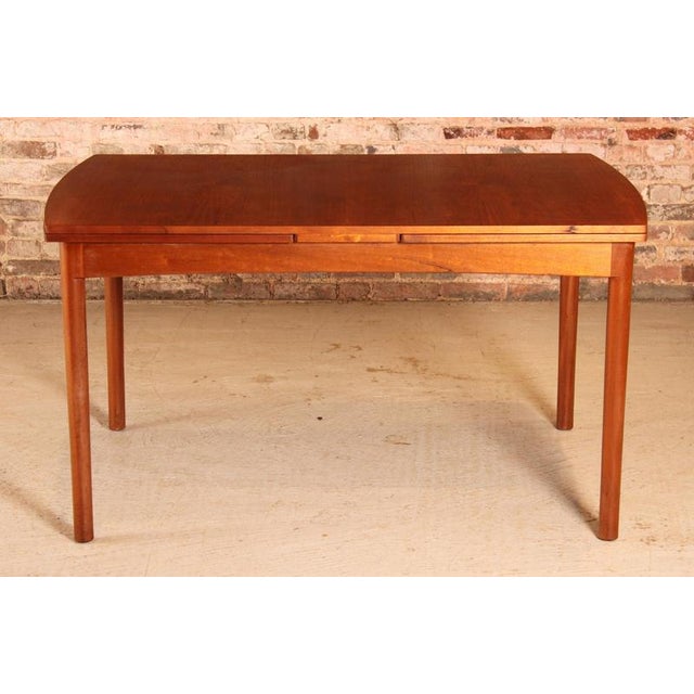 Mid Century extending teak dining table by Beithcraft, Scotland, circa 1960s. Extends to 244cm to seat up to 10 people....