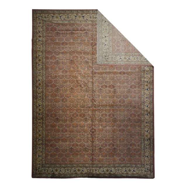 This east Anatolian workshop carpet features a beige field closely patterned with offset, half-drop rows of uniform, tight...