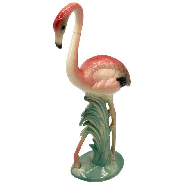 Mid-century pink and green ceramic flamingo tabletop statue by Brad Keeler. It features a beautifully detailed pink...