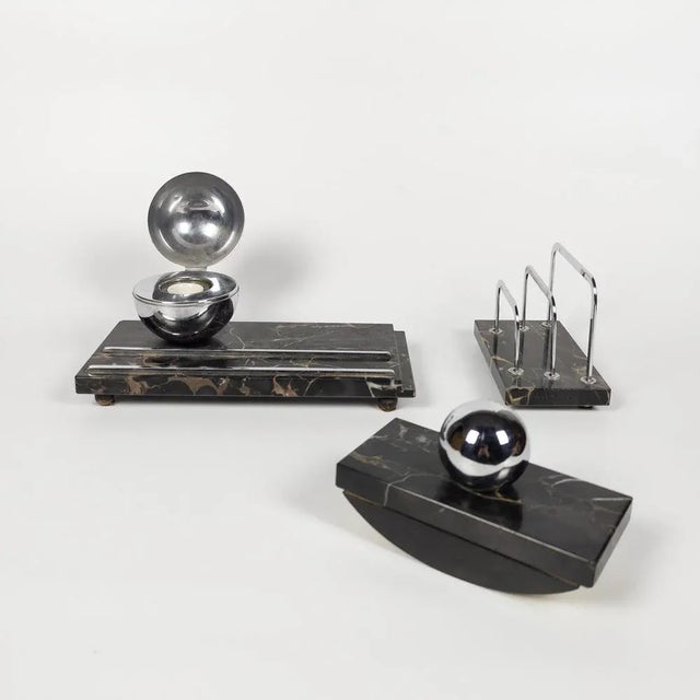 An inkwell, a mail buffer and a pad with ink blotting paper. Manufactured in France during 1930's. Made of Italian Portoro...