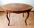 The table is made of solid walnut wood. The dimensions are 120 cm long 86 cm deep 75 cm high