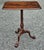 A George III Style Crotch Mahogany Pedestal Tilt Top Side Table Measure 28.5" in height and 24" in width and 16" in depth.