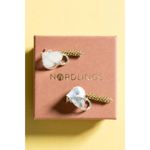 Exquisite silver earrings by Gertrud Engel, in the form of birch leaves, with gilded seed pods loosely suspended....