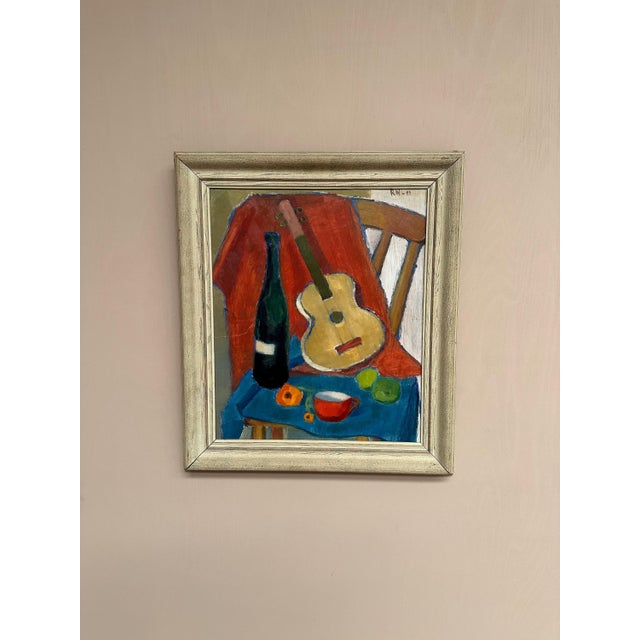 Original swedish oil on canvas – “still life with guitar and wine bottle” – signed rn, 1949 – vintage & framed – 59 × 68...