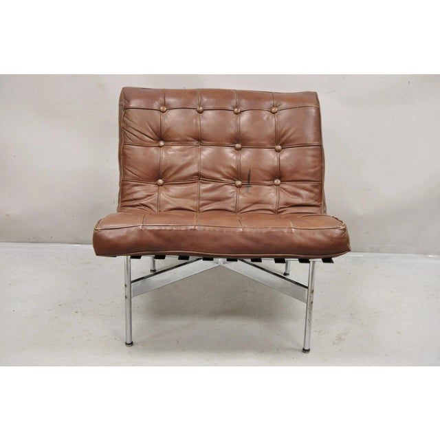 "New York" Brown Leather Lounge Chair by Katavolos Littell Kelley for Laverne. Item features a heavy steel frame and...