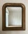 A warm, intimate mirror sourced from a Roman home...the kind of piece that anchors a bedroom wall or catches light in a...