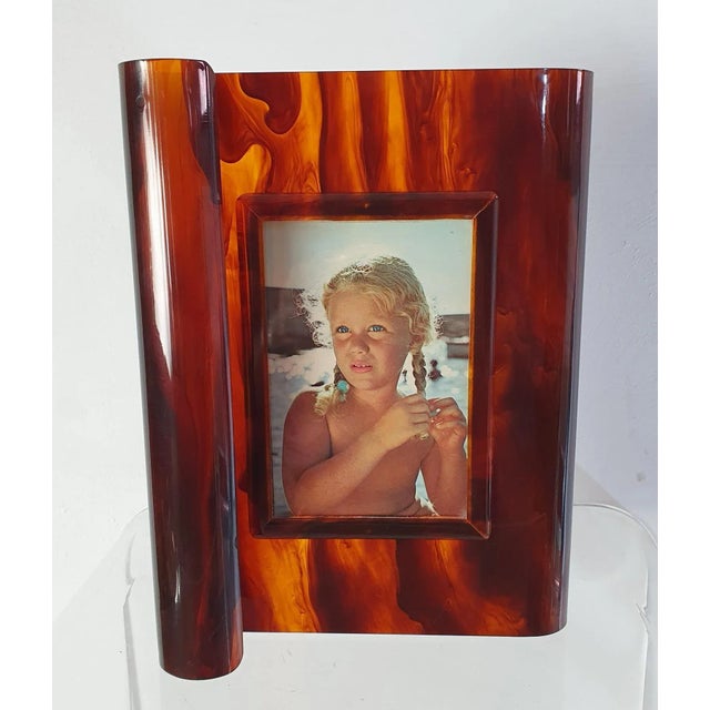 Art Deco style photo/picture frame in acrylic glass faux tortoiseshell acrylic glass with an S curved design. This piece...