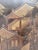 Spectacular six panel Chinese coromandel folding screen with hand-painted relief gilt decoration. This large Chinoiserie...