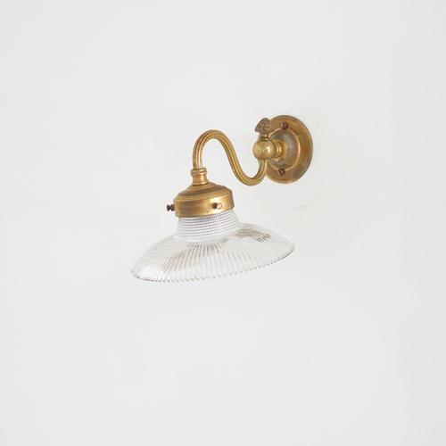 A low profile antique glass prismatic pendant light shade. The light has retained its original brass wall bracket, which...