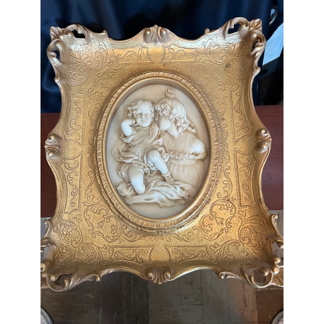 French Gilt Wall Plaque with Marble Insert of Mother and Child. Frame has Intricate Detail.