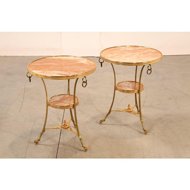 High Quality Vintage Pair of Brass Paw Foot Side Tables with Two Round Inset Marble Tiers, Mounted on Rolling Casters