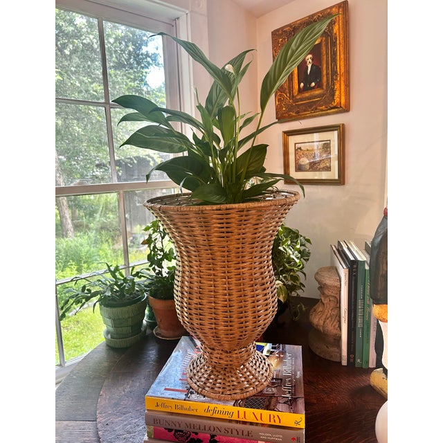 This wicker urn is 16” tall and is a perfect accessory for a beach house or garden room. The wicker is tightly woven and...