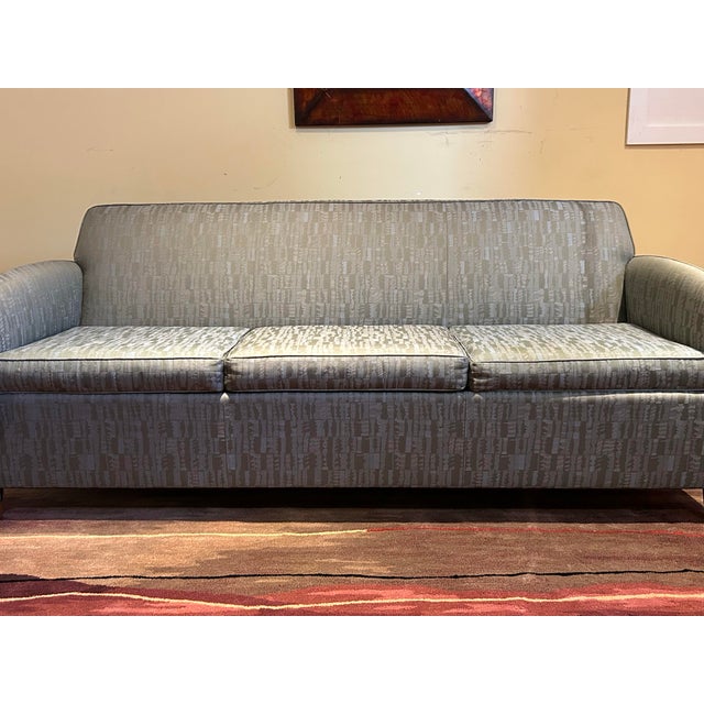 Beautiful MCM blue sofa. Wood accent pieces.