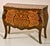 Handcrafted in Italy, this elegant bombe chest features satinwood veneers arranged in rich marquetry patterns across the...