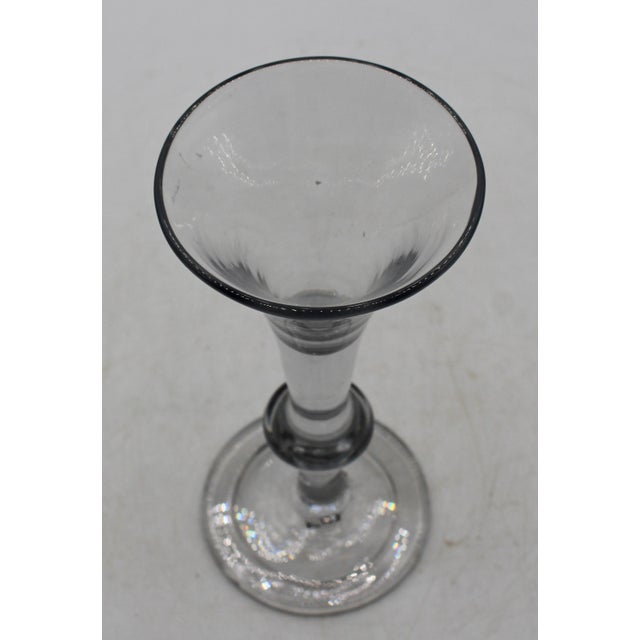 Circa 1730-40 George II period wine glass. “Kit-Cat” balustroid form with short drawn trumpet bowl on heavy stem with...