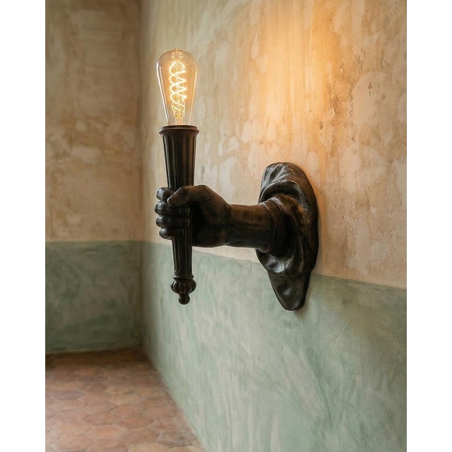 Antique 19th Century iron arm bracket. Wall bracket cast in the form of an outstretched arm. Probably used to hold a...