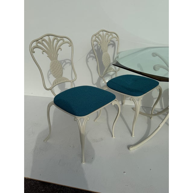 Set of cast aluminum newly powder coated pineapple patio table and four chairs made my Thineline of Santa Ana Glass top is...