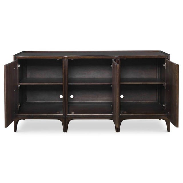 Inspired by 1960's architecture, this hardwood cabinet with Walnut veneers features streamline tapered and curved legs,...
