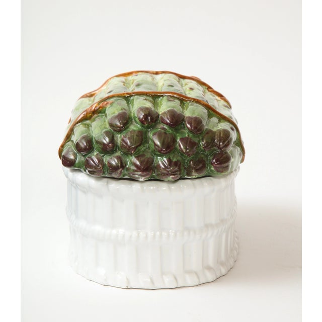 The cover modeled as a bundle of tied asparagus, set on a white basket-form base. Signed on bottom: Meiselman 8409-Made in...