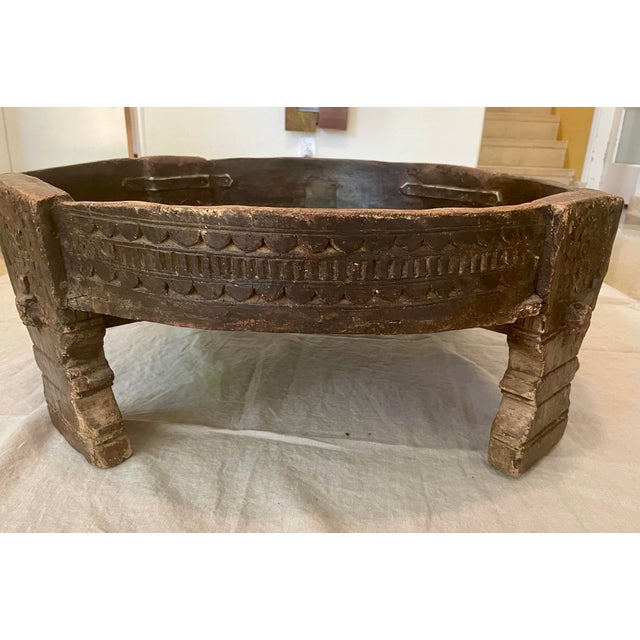 his exquisite piece of furniture radiates an antique aura that will add charm to any room. The eye-catching round shape...