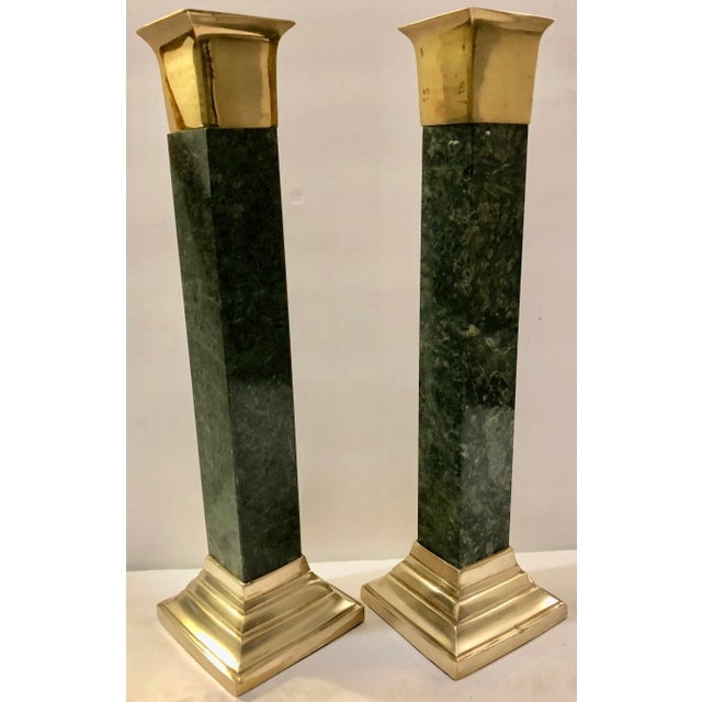 Beautiful pair of green marble and brass candle holders. They are very elegant and of the highest quality.