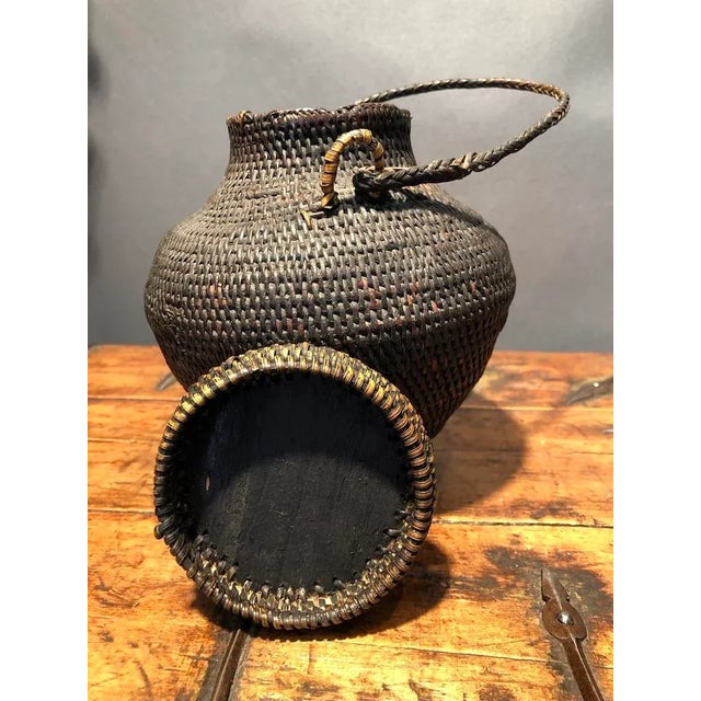 This ulbong from the Ifugao region of the Philippines is a rare find. Handled and lidded, the basket is very strong. Most...