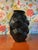 An elegant black vase by Lalique, showcasing the brand’s iconic artistry and refined craftsmanship. This signed and...