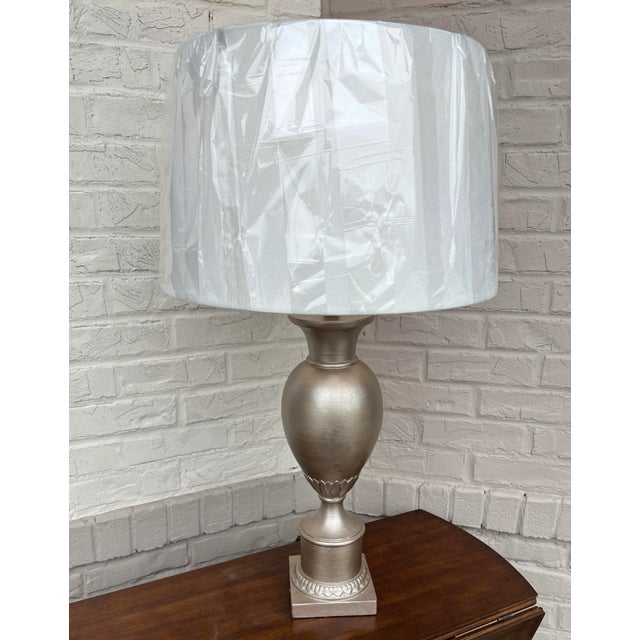 High quality neoclassical urn shaped table lamp with beautiful warm silver painted finish. Lamp measures 30" to top of...