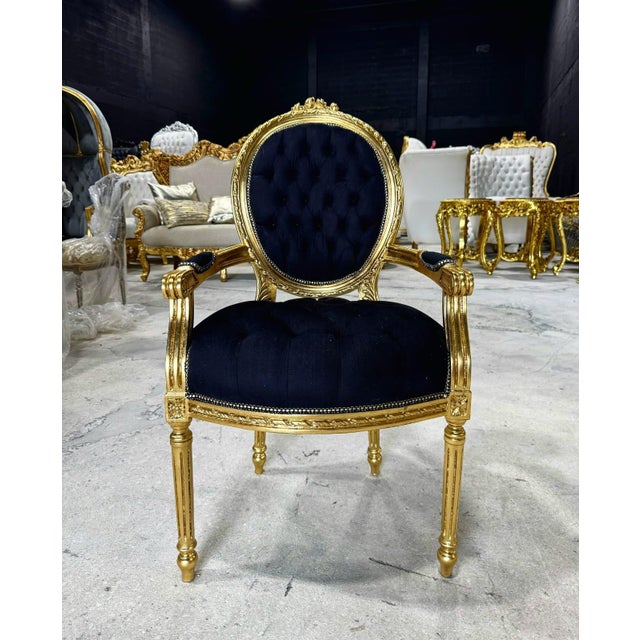 Enhance your space with this stunning French Rococo–style armchair. Fully restored with gold leaf, this chair features...
