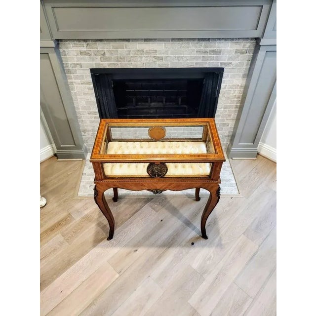 A beautiful, very fine quality French patinated gilt-bronze mounted vitrine / display case table with elegant silk tufted...