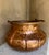 Large antique hammered copper cauldron with handle. Uniquely shaped, larger in the middle than the top and base. Great for...