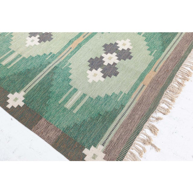 Vintage Swedish Flat Woven by Ingegerd Silow Size: 5'5" × 8'2" (165 × 248 cm) This exceptional flat-woven Swedish rug by...