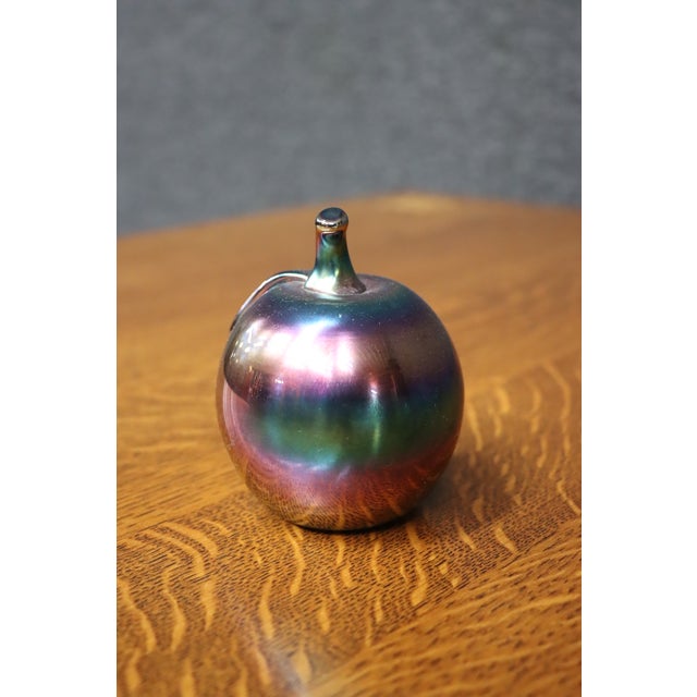 Decorative hand-blown art glass apple by SEA Glasbruk of Sweden. Finished in a striking iridescent luster that shifts...