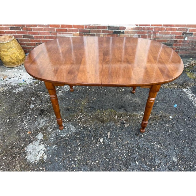Heywood Wakefield Early American Style Solid Maple Dining Table With Leaf. Circa 1960s Solid wood frame, turned legs,...