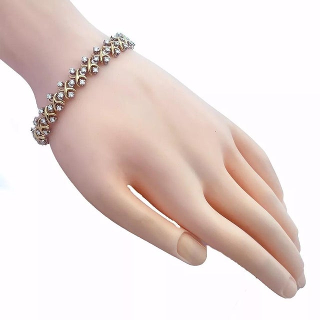 A stunning authentic bracelet from Tiffany & Co. by designer Schlumberger from his X Collection. It is crafted from 18k...