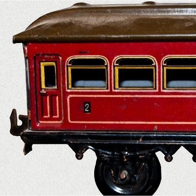 This Karl bub 7-window passenger coach is an original vintage toy. Vintage toy representing a seven window passenger...