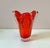 A stunning vibrantly colored freeform chunky glass vase in a deep red color with clear glass casing. C.1950's. Dimensions:...