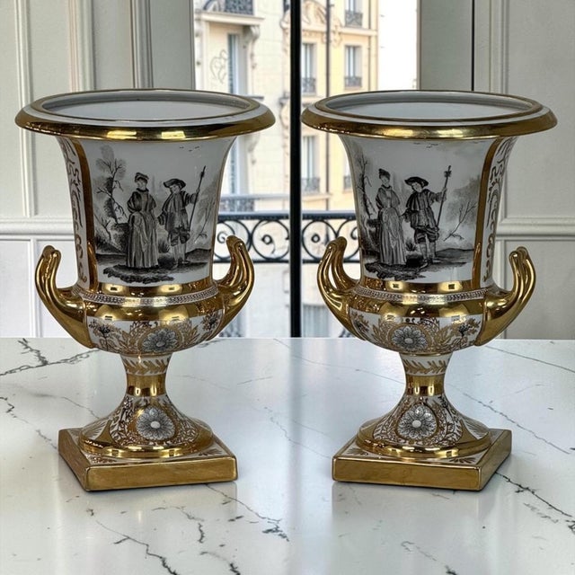 Striking and exquisite, this rare pair of Ritzenhoff & Breker porcelain mantel urns celebrates the elegance and romance of...