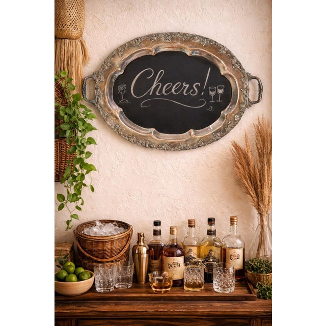 Early 20th century silver plated serving tray creatively repurposed into a decorative chalkboard, blending formal antique...