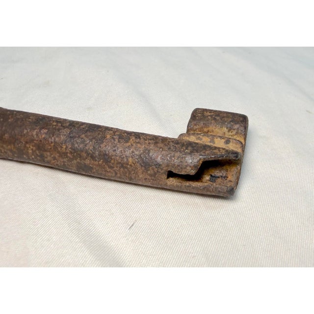 This 18th century hand wrought iron open barrel shaft skeleton key is a rare and unique collectible piece. The key's...