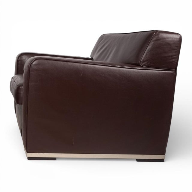 This Apta Imprimatur leather armchair in a warm brown leather tone is in excellent condition. The leather is flawless,...