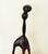 Modernist sculpture of one carved piece of wood. Measurements: Height: 18.5" Width: 8.5"