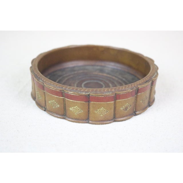 An early 20th century English wine coaster made by the Original Books Works Ltd. of Gloucestershire, England and bearing...