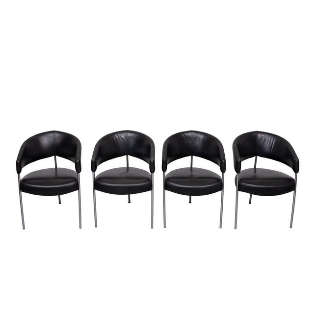 Very nice Black Leather Dining chairs . Three legged base , in polished Aluminum . Top quality smooth Leather ....