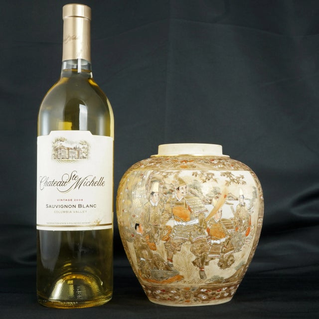 A very intricately decorated Japanese satsuma ginger jar that glows from all of the gold decoration. A ceramic has been...