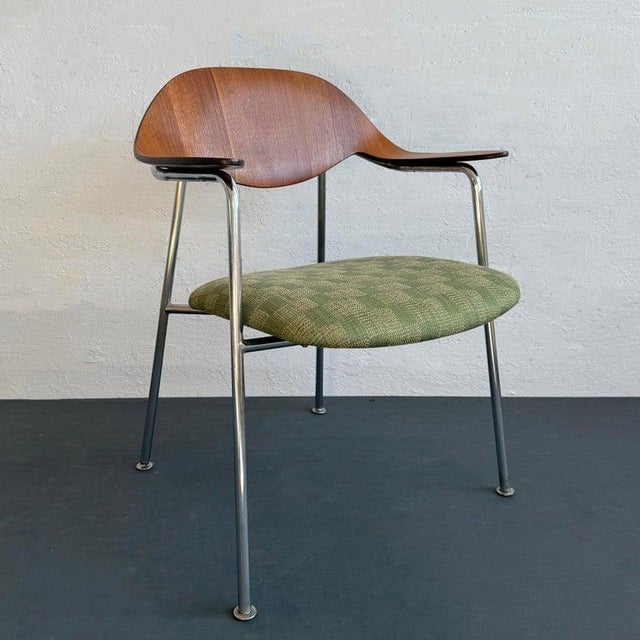 This Mid-Century Modern armchair was designed by American designer George Mulhauser, circa 1964, for a competition to...